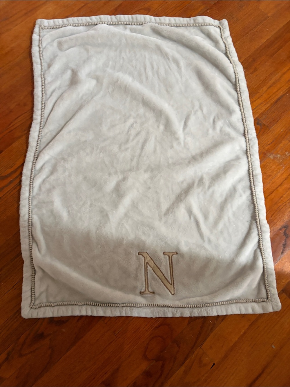 Levtex Cream Plush Baby Blanket with Pom Trim